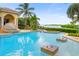 Inviting pool with water features, offering scenic waterfront views at 1363 Oceanview Dr, Tierra Verde, FL 33715