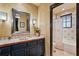 Well-appointed bathroom with dark vanity, tile accents and shower/tub combo at 33642 Blanton Rd, Dade City, FL 33523