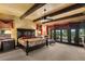 Large bedroom with dark wood furniture and access to balcony at 33642 Blanton Rd, Dade City, FL 33523