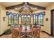 Charming breakfast nook with a round table and views to backyard at 33642 Blanton Rd, Dade City, FL 33523
