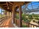Covered patio with terracotta tile floor and lush landscaping at 33642 Blanton Rd, Dade City, FL 33523