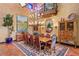 Formal dining room with a large table, chandelier, and hardwood floors at 33642 Blanton Rd, Dade City, FL 33523
