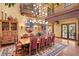 Elegant dining room with a large table, chandelier, and hardwood floors at 33642 Blanton Rd, Dade City, FL 33523