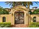 Ornate iron gate leading to a grand estate at 33642 Blanton Rd, Dade City, FL 33523