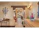 A view down a long hallway with tiled floors and a staircase at 33642 Blanton Rd, Dade City, FL 33523