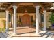 Elegant entryway with columns and a wood door at 33642 Blanton Rd, Dade City, FL 33523