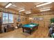 Game room featuring a pool table and wood paneled walls at 33642 Blanton Rd, Dade City, FL 33523