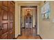 Long hallway with hardwood floors and rustic decor at 33642 Blanton Rd, Dade City, FL 33523