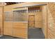 Spacious horse stable with wooden stalls and metal gates at 33642 Blanton Rd, Dade City, FL 33523