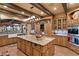 Island kitchen with granite countertops and wooden cabinets at 33642 Blanton Rd, Dade City, FL 33523