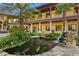 Serene koi pond with lush landscaping and a stone waterfall feature at 33642 Blanton Rd, Dade City, FL 33523