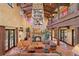 Living room with large stone fireplace and comfortable seating at 33642 Blanton Rd, Dade City, FL 33523