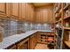 Walk-in pantry with ample shelving and tile flooring at 33642 Blanton Rd, Dade City, FL 33523