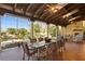 Covered patio with seating area and outdoor fireplace at 33642 Blanton Rd, Dade City, FL 33523