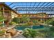Inviting pool and spa with a covered patio and lush landscaping at 33642 Blanton Rd, Dade City, FL 33523