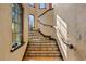 Grand staircase with ornate tile and wooden handrail at 33642 Blanton Rd, Dade City, FL 33523