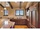 Curved wet bar with granite countertop and wooden cabinets at 33642 Blanton Rd, Dade City, FL 33523