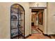 Charming wine cellar with decorative iron gate and tile accents at 33642 Blanton Rd, Dade City, FL 33523