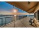 Scenic waterfront patio boasting ample seating with sunset views over the bay at 622 Edgewater Dr # 822, Dunedin, FL 34698