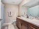 Bathroom with granite countertops and a double sink vanity at 10704 Sage Canyon Dr, Riverview, FL 33578