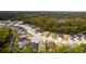 Aerial view of a residential neighborhood with houses and lush greenery at 11468 Weaver Hollow Rd, New Port Richey, FL 34654