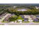 Aerial view of community with lake and pool at 11468 Weaver Hollow Rd, New Port Richey, FL 34654