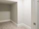 Small walk-in closet with neutral-colored walls and carpeted floor at 11468 Weaver Hollow Rd, New Port Richey, FL 34654