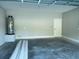 Spacious garage with concrete floor and extra storage space at 11468 Weaver Hollow Rd, New Port Richey, FL 34654