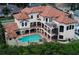 Luxury home aerial view showcases a large pool and spiral staircase at 109 Wateredge Ct, Safety Harbor, FL 34695