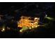 Night view of a luxury home with pool and lush landscaping at 109 Wateredge Ct, Safety Harbor, FL 34695