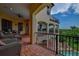 Balcony with wicker furniture and scenic view at 109 Wateredge Ct, Safety Harbor, FL 34695