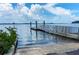 Concrete boat ramp leading to calm water under a partly cloudy sky at 109 Wateredge Ct, Safety Harbor, FL 34695