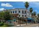 Two-story commercial building with outdoor seating and palm trees at 109 Wateredge Ct, Safety Harbor, FL 34695