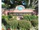 Safety Harbor community entrance sign with brick pillars and landscaping at 109 Wateredge Ct, Safety Harbor, FL 34695