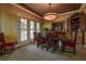 Elegant dining room with ornate furniture and French doors to balcony at 109 Wateredge Ct, Safety Harbor, FL 34695