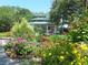 A picturesque gazebo surrounded by vibrant flowers in a lush garden setting at 109 Wateredge Ct, Safety Harbor, FL 34695