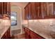 Well-equipped kitchen featuring granite countertops and wood cabinets at 109 Wateredge Ct, Safety Harbor, FL 34695