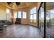 Living room features hardwood floors, large windows, and access to balcony at 109 Wateredge Ct, Safety Harbor, FL 34695