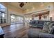 Spacious living area with hardwood floors, sectional sofa and kitchen views at 109 Wateredge Ct, Safety Harbor, FL 34695