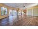 Large living room with hardwood floors and pool view at 109 Wateredge Ct, Safety Harbor, FL 34695