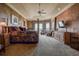 Main bedroom with lake view and sitting area with two armchairs at 109 Wateredge Ct, Safety Harbor, FL 34695