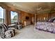 Main bedroom with sitting area, large windows, and a king-size bed at 109 Wateredge Ct, Safety Harbor, FL 34695