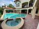 Luxury pool and spa with brick pavers and covered patio at 109 Wateredge Ct, Safety Harbor, FL 34695