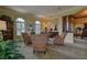 Cozy sitting area featuring comfortable armchairs and a wood cabinet at 109 Wateredge Ct, Safety Harbor, FL 34695