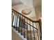 Elegant staircase with ornate railing and decorative ceiling detail at 109 Wateredge Ct, Safety Harbor, FL 34695