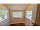 Attic room featuring natural light from two windows and classic hardwood flooring at 1414 7Th S St, St Petersburg, FL 33701