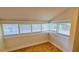 Attic space bathed in natural light, showcasing hardwood floors and neutral walls at 1414 7Th S St, St Petersburg, FL 33701