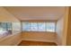 Bright bedroom featuring wood flooring, multiple windows for natural light, and neutral walls at 1414 7Th S St, St Petersburg, FL 33701