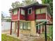 Side view of red house with stone base at 1414 7Th S St, St Petersburg, FL 33701
