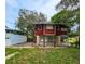 Side view of red house with grassy yard at 1414 7Th S St, St Petersburg, FL 33701